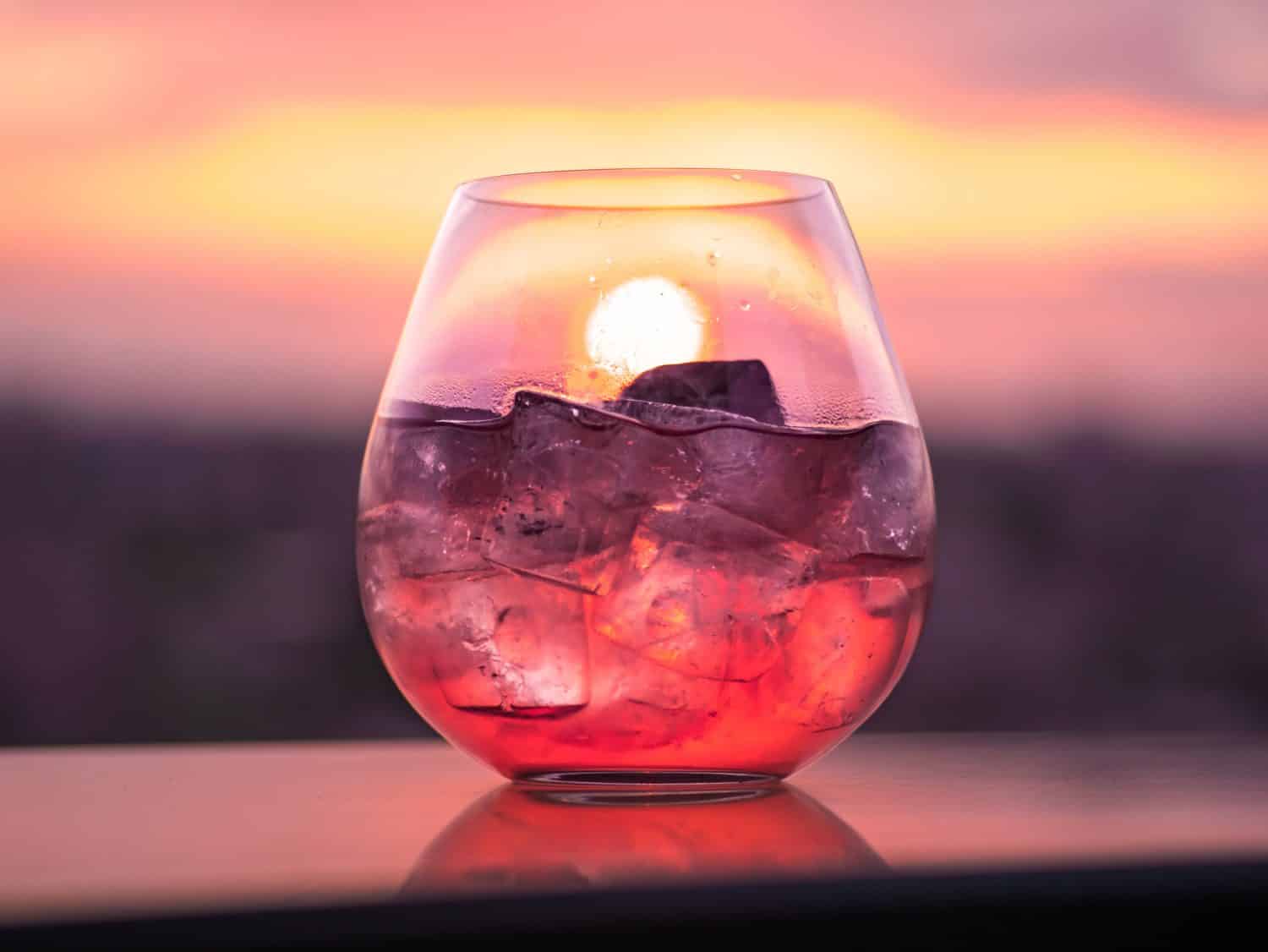 glass of alcohol with ice