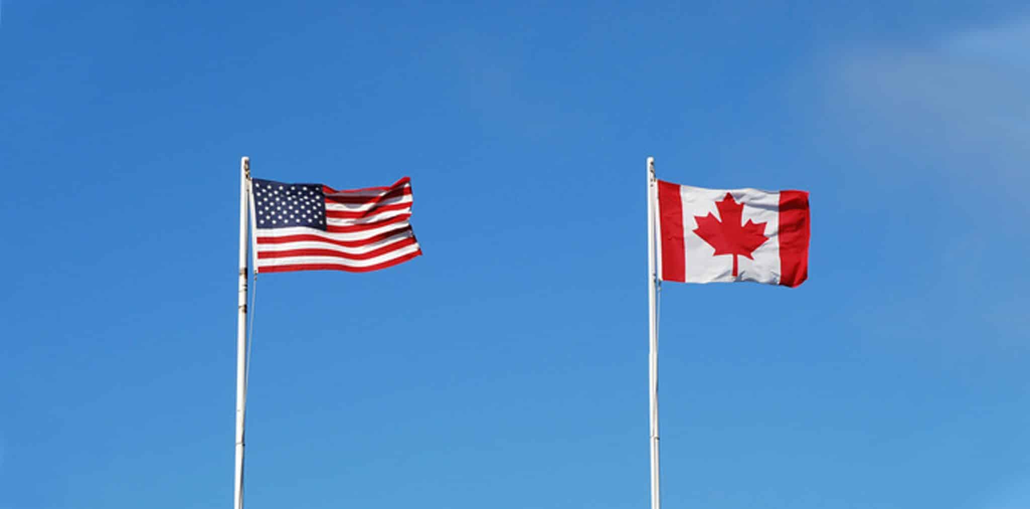 A photo of Canadian and US flags.